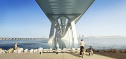 View of looking out towards river from under the bridge with people