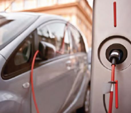 Electric car at charging station