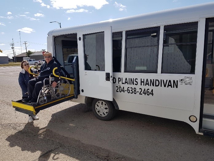 Rider getting on wheelchair accessible handivan