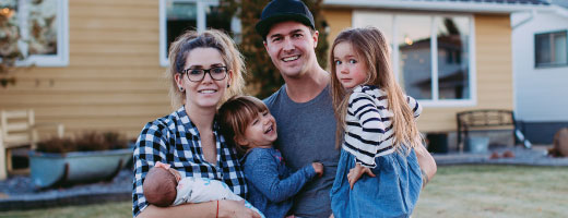 Family in front of home