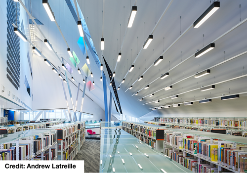 Interior of a modern library with rows of bookshelves.