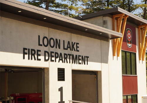 Loon Lake Fire Department 1 in large letters on the exterior of a firehall.