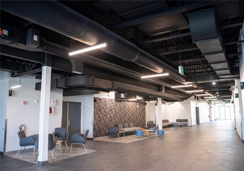 A hall with seating areas inside of a municipal centre.