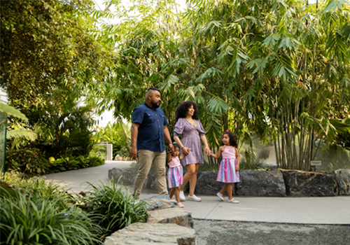 A family walking through a biome