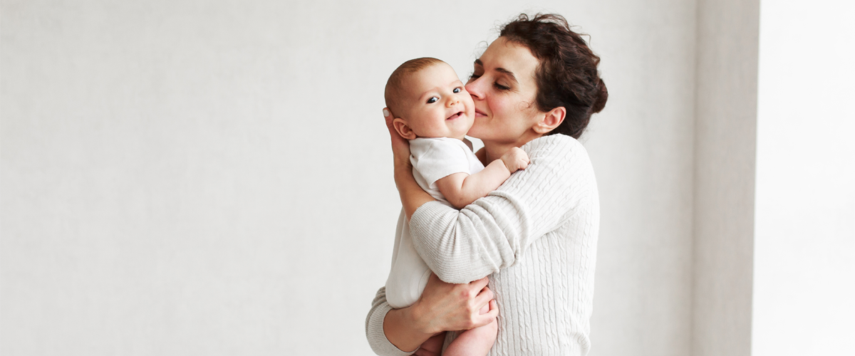 Parent holding a baby.