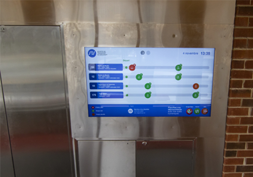 A display panel inside of a bus station showing bus routes.