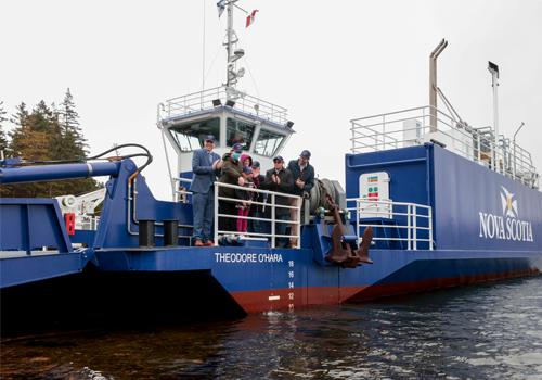 A group of people on a blue ferry boat.